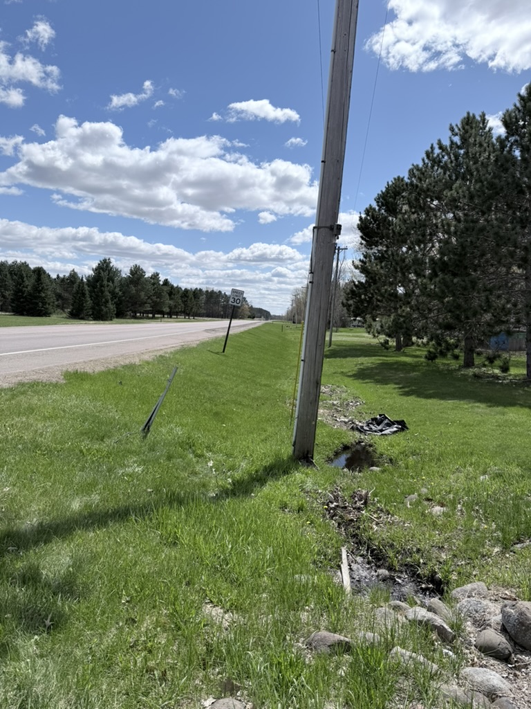 Portage Avenue in Mora — a roadway with no sidewalk where pedestrians share space with traffic